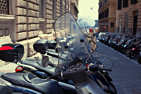 A long row of motorbikes line-up in Napoli, Italy thumbnail