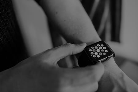 person touching Apple Watch thumbnail