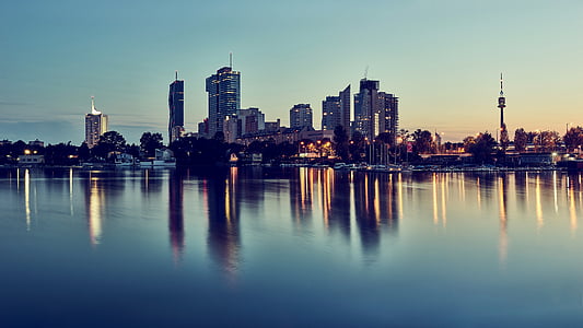 silhouette of city buildings during golden hour thumbnail