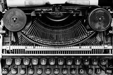close up photo of black type writer machine thumbnail