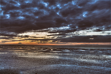 Seascape shot taken of the coast of Southern England on a stormy sunset evening thumbnail