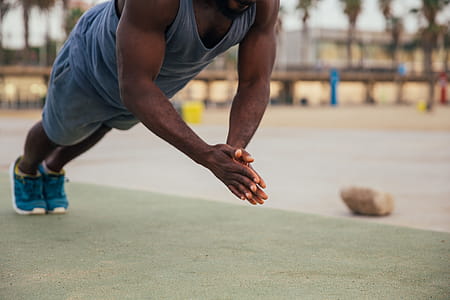 Clapping push-up exercise by a young african man outdoors thumbnail