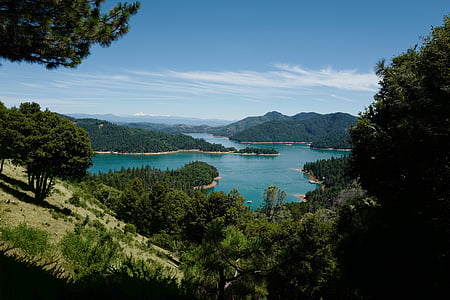 mountains near body of water thumbnail