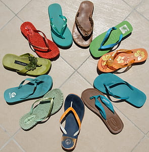 selective focus photography of flip-flops on floor thumbnail