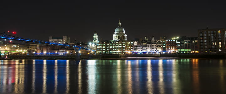 lighted buildings near body of water thumbnail