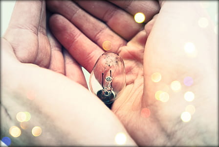 Centered Clear Bulb on Human Hand thumbnail