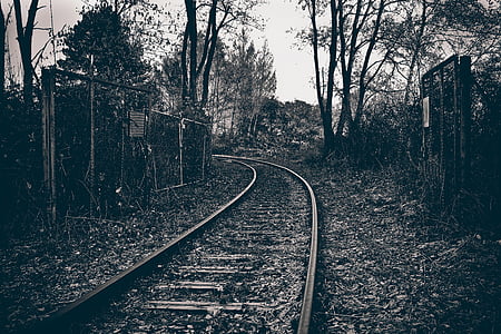 grayscale photo of train rail thumbnail