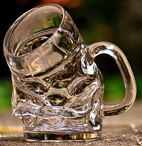 clear cut glass mug melted on ground thumbnail