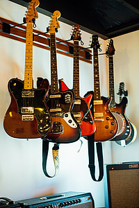 Electric guitars hanging on wall thumbnail