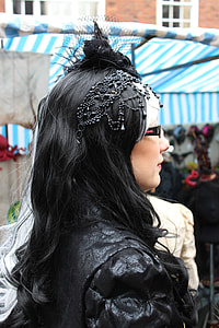 women's black head dress; hair and suit during day time thumbnail