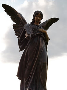 black female angel statue under cloudy sky during daytime thumbnail