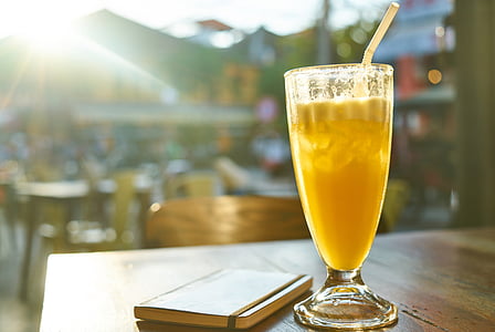 yellow liquid on clear drinking glass thumbnail