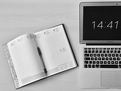 notebook beside MacBook Air thumbnail