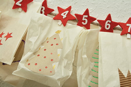 paper with numbers hanging in front of white surface thumbnail