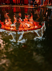 group of people standing near carousel thumbnail