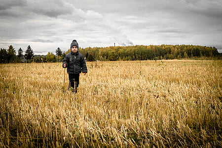 child walking on crop field thumbnail