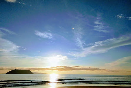 Panoramic Photography of Beach With Sun thumbnail