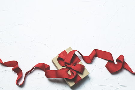 Red and White Gift Box With Ribbon Bow thumbnail