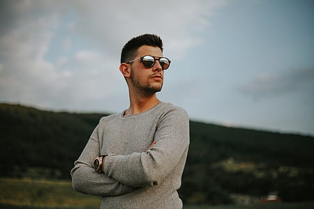 man with holding body while staring side-ways thumbnail