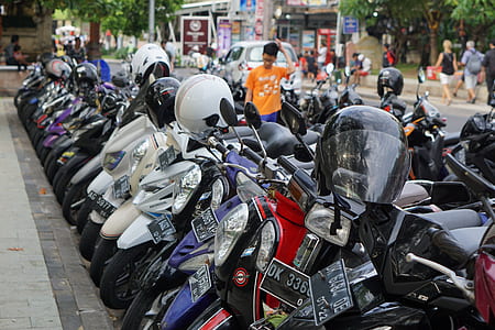 parked motorcycles near boy thumbnail