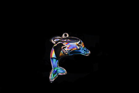 multicolored glass dolphin pendant in black background thumbnail