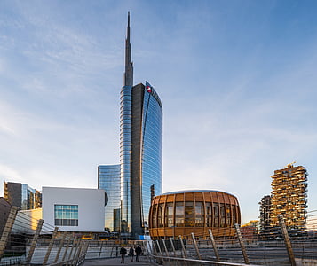 gray high-rise building under blue and gray skies thumbnail