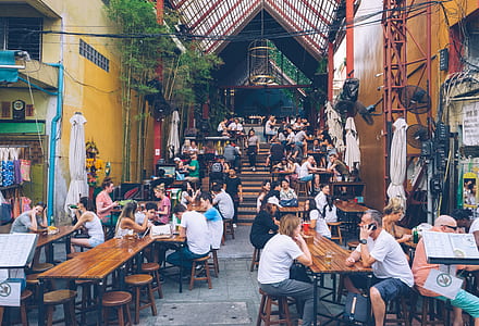 group of people sitting on patio dining table thumbnail