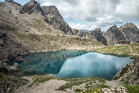 gray rocky mountain under blue sky thumbnail