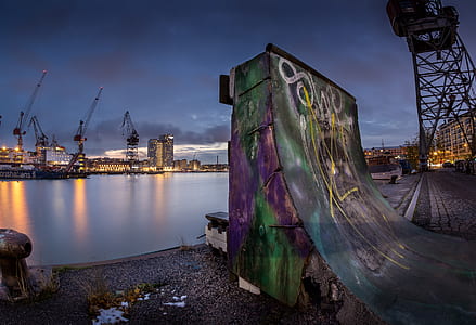 multicolored skateboard ramp near body of water thumbnail