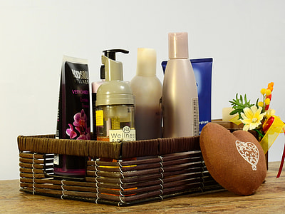 cosmetic products in brown wicker basket thumbnail