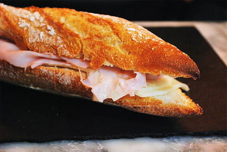 ham sandwich on black plate thumbnail