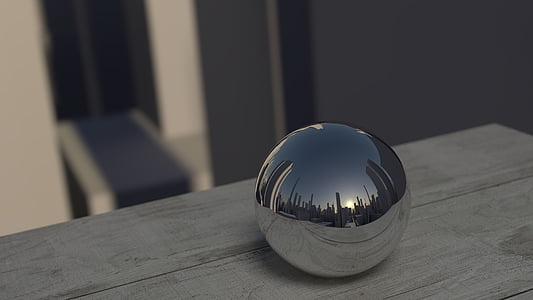 silver ball decor on top of gray wooden surface thumbnail