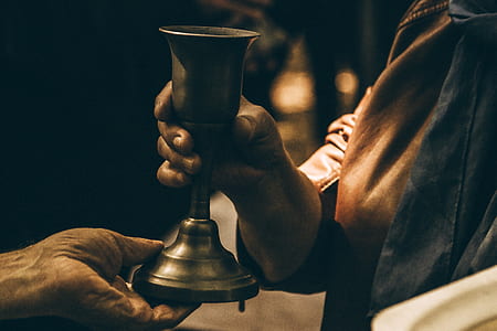 person holding footed cup thumbnail