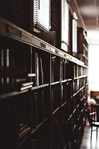 focus photography of book shelf thumbnail