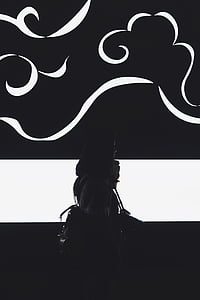 silhouette of woman carrying bag thumbnail
