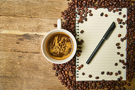white ceramic mug filled with brown liquid thumbnail