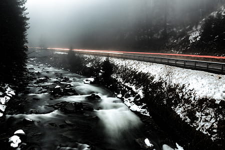 Time Lapse Photo of River Beside Highway during Cloudy Weather thumbnail