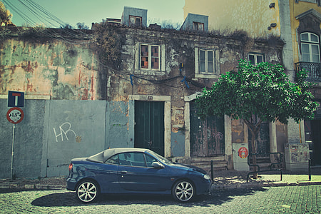 Street shot of a car sitting on an old back street in Lisbon, Portugal, image captured with a Canon DSLR thumbnail