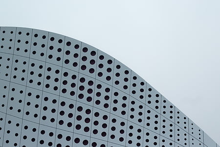 low-angle photograph of high-rise building under cloudy sky thumbnail