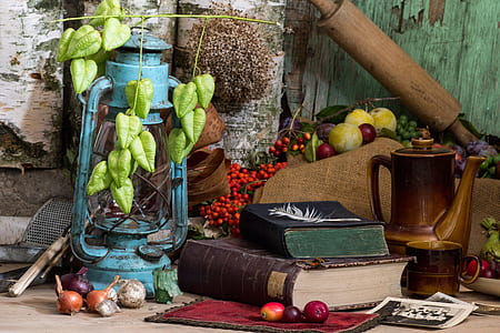 two title books near teal kerosene lamp thumbnail