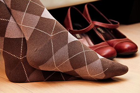 person feet beside red Mary Jane shoes thumbnail