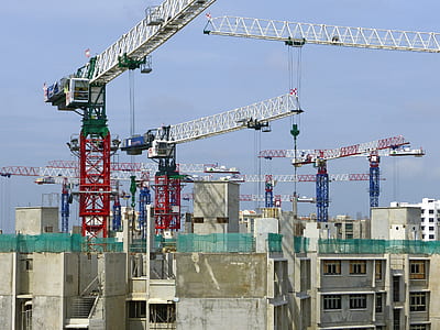 white and red crane on top of buildings thumbnail