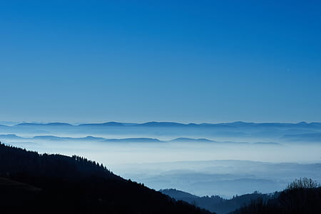 silhouette of mountains surrounded by fogs thumbnail