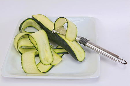 silver kitchen utensil peeling cucumber thumbnail