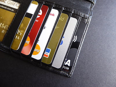 assorted-color cards on black leather wallet thumbnail