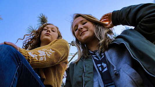 two women looking down thumbnail
