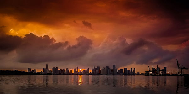 silhouette photo of city buildings during dawn thumbnail