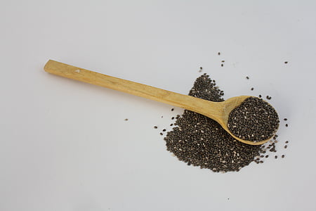 brown wooden spoon with black seeds thumbnail