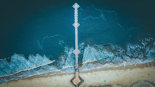 aerial photography of boardwalk on body of water at daytime thumbnail