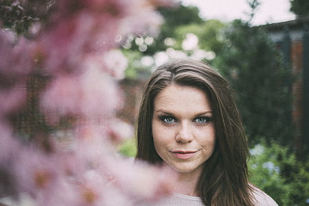woman beside flower thumbnail